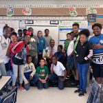 University of West Florida Graduate Harrison Peters in classroom with students
