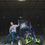 steven thornton with the off-road vehicle that was fabricated by UWF SAE Baja team that he led